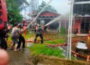Sinergi Babinsa, Damkar dan Warga Jinakkan Api di Banua Binjai